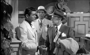 映画『お熱いのがお好き』でマフィアのスパッツを演じたジョージ・ラフトと、かつての盟友エドワード・G・ロビンソンの息子エドワード・ロビンソン・ジュニア